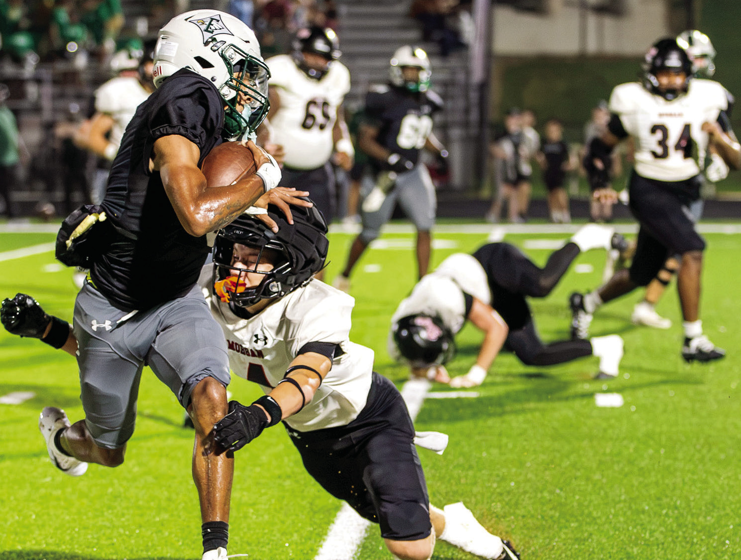 Morgan County senior defensive back Grant Smith (4) attempts to tackle Eagles ball carrier during as the Bulldogs beat Class 5A Eastside. SEE LAKE COUNTRY SPORTS COVERAGE >> PAGE B1 SKYLA MORRIS/Staff