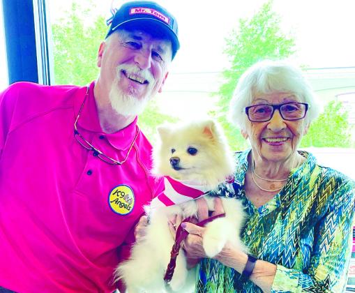 Tom Meyers and his therapy dog Ora Mae share a smile with Edna Slosvig at Lake Oconee Dentistry’s free day of dentistry for veterans, active military, and hometown heroes. CONTRIBUTED