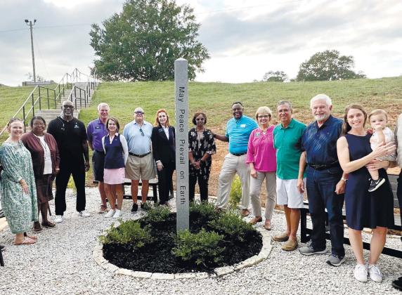 Members of the Rotary Club of Greene and Putnam Counties pose around the Rotary Peace Pole located at the Pete Nance Boys and Girls Club. CONTRIBUTED