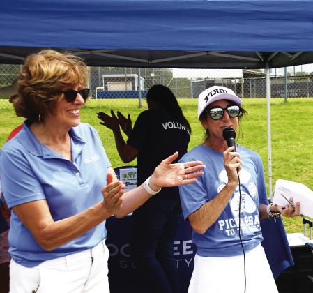 Lake Oconee Humane Society Board President Barbara Gniewek (left) and Central Georgia USA Pickleball Ambassador Kelley Chitwood joined in making the announcement April 18, of raising more than $11,000 for animal care and advocacy in Lake Country. IAN TOCHER/ Staff