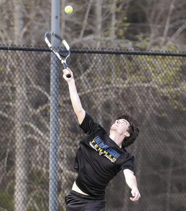 Lake Oconee Academy senior Henry Hynes prepares to serve during a match earlier this season. SKYLA MORRIS/Staff