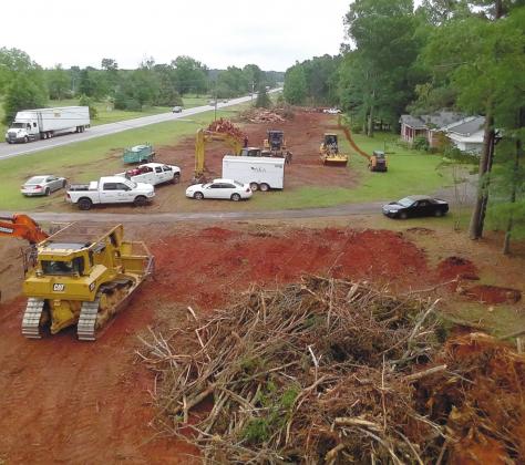 Brush and debris are cleared to prepare for the widening of US 441. MARK ENGEL/Staff