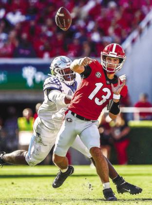 Quarterback Stetson Bennett went 14-20 passing in 2021 against Kentucky for 250 yards and three touchdowns with no interceptions for an average of 12.5 yards per play. He also rushed three times for 22 yards. MACKENZIE MILES/UGA Athletics