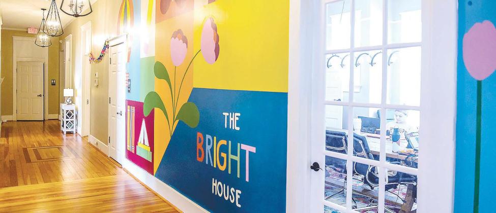 Maggie Morgan’s mural at The Bright House in Baldwin County. The mural features a colorful backdrop for a variety of simple designs hand-selected to represent hope, restoration, transformation, and growth. COURTESY OF GCSU