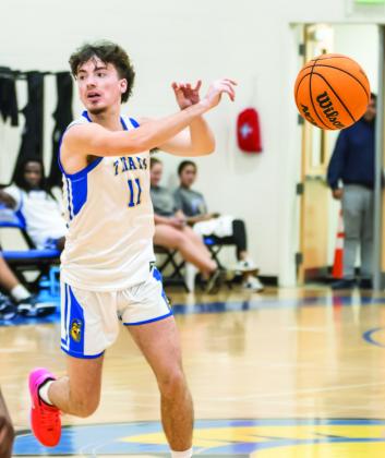 Lake Oconee Academy senior Henry Hynes makes a no-look pass to a teammate. SKYLA MORRIS/Staff