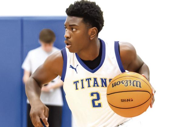Lake Oconee Academy senior Corrion Jernigan tries to find a teammate to pass to in transition. SKYLA MORRIS/ Staff