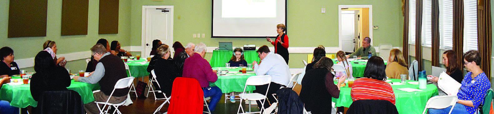 Several Putnam County citizens and representatives of local governmental and social assistance organizations were on hand as Rebekah Hudgins of the Georgia Family Connection Partnership gave her presentation. LENA HENSLEY/Staff