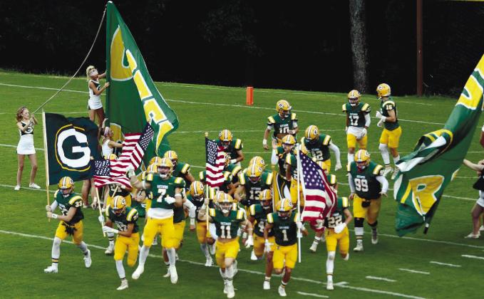 In a game earlier this season, the Gatewood Gators take the field at Sammons Field in Eatonton. IAN TOCHER/File photo