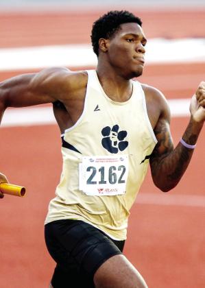 Greene County senior Dontriel Grable runs his leg of the boys 4x400-meter relay during the state meet Monday at UGA’s Spec Towns Track in Athens. LANCE McCURLEY/Staff