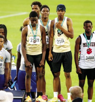 The Greene County boys 4x400-meter relay team stands on the podium at UGA’s Spec Towns Track in Athens after placing fifth at the state meet with a time of 3:31.69. LANCE McCURLEY/Staff