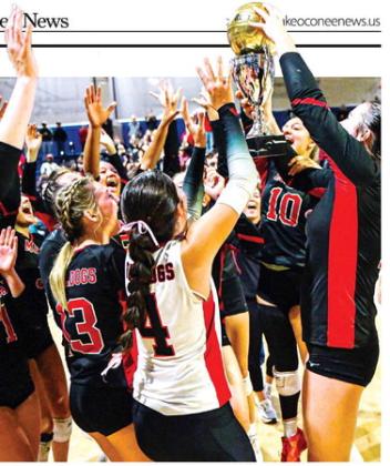 Members of the Morgan County volleyball team celebrate with the championship trophy after defeating Ringgold in the Class AA state title match on Oct. 30, 2025. CHARLES JORDAN/File photo