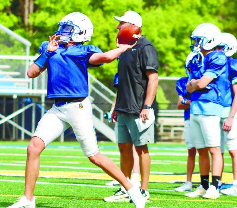 Lake Oconee Academy quarterback Ike O’Neal, who transferred from Morgan County, during throwing drills at a spring practice a few weeks ago. LANCE McCURLEY/Staff