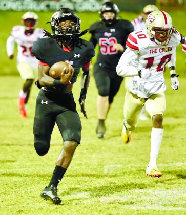 Jay Dorsey (1) rushes away from defenders on an 80-yard touchdown in the third quarter of Friday’s win over Cross Creek. JIM TURNER/Contributed