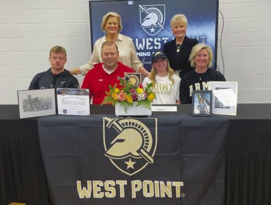 Flanked by her family, Morgan County senior Caroline Jenkins (second from right, front row) recently signed to dive at West Point at the next level. CONTRIBUTED