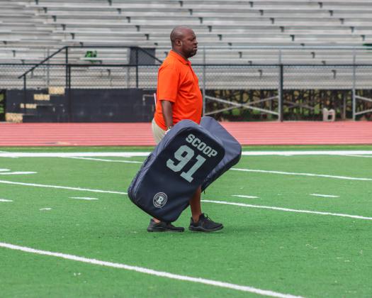 Greene County head coach Terrance Banks setting up for a drill on Monday. LANCE MCCURLEY/Staff
