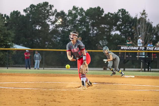 Ryleigh Hilsman (11) gets set to deliver a pitch from the circle last week against Prince Avenue. LANCE MCCURLEY/Staff