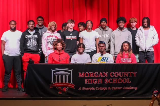 Brown and his teammates from Morgan County's 2022-23 boys team pose for a photo on Wednesday. LANCE MCCURLEY/Staff