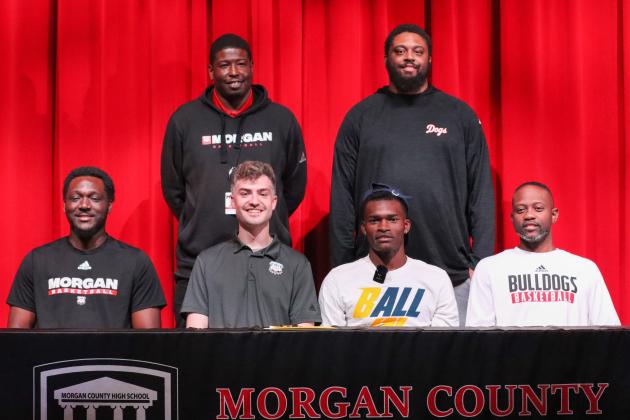 Brown and the Morgan County coaching staff at his signing ceremony. LANCE MCCURLEY/Staff