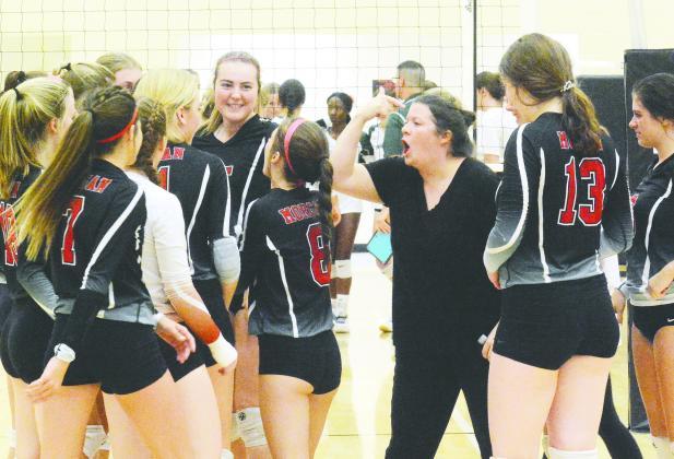 Spike Dogs’ head coach Kat Goodwin gets her team fired up after a victory on the road to becoming state champions. BRENDAN KOERNER/Staff