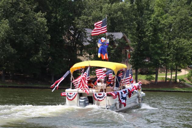Host Joe Williamson's boat featured an inflatable Uncle Sam on top of his pontoon boat. LANCE MCCURLEY/Staff