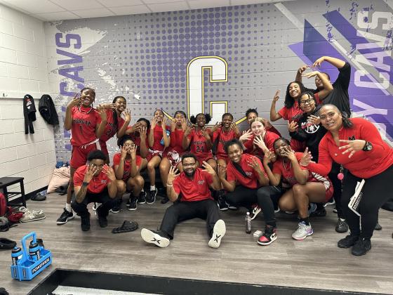 The Lady Dogs pose for a photo after knocking off No. 1 seed Calvary Day last Friday. CONTRIBUTED
