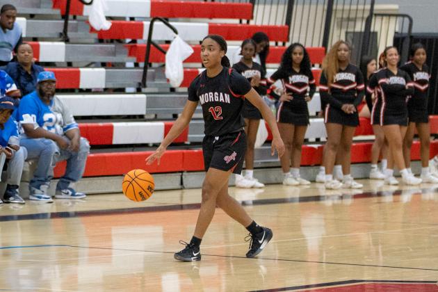 Morgan County junior guard Miracle Ward brings the ball up the floor. SKYLA MORRIS/Staff