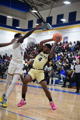 Greene County forward Dontriel Grable (4) gets set to pass the ball to a teammate during a game against Washington-Wilkes in the Region 8 - A Division II tournament on Feb. 18. JUSTIN RILEY/Contributed