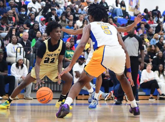 Greene County guard Keith Hall (22) dribbles the ball during a game against Washington-Wilkes in the Region 8 - A Division II tournament on Feb. 18. JUSTIN RILEY/Contributed