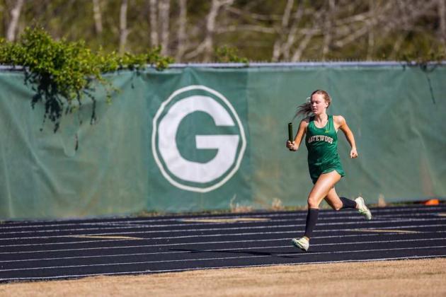 Gatewood senior Presley Moss runs her part of a relay race at a home meet earlier this season. CONTRIBUTED