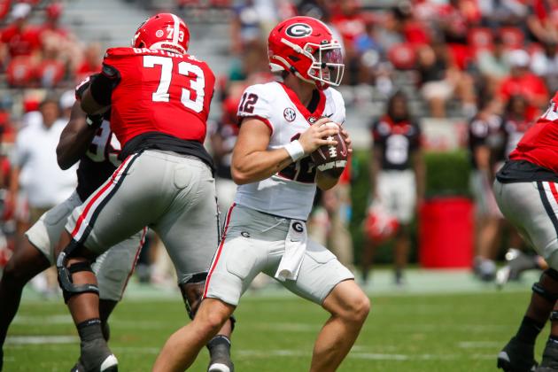 Georgia redshirt freshman quarterback Ryan Puglisi (12) gets set to fire a pass downfield during the G-Day scrimmage. LANCE McCURLEY/Staff