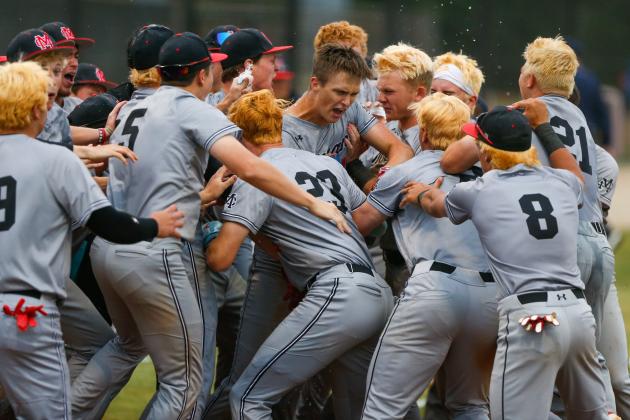 Strickland celebrates with his Bulldog teammates after crossing him plate. LANCE MCCURLEY/Staff
