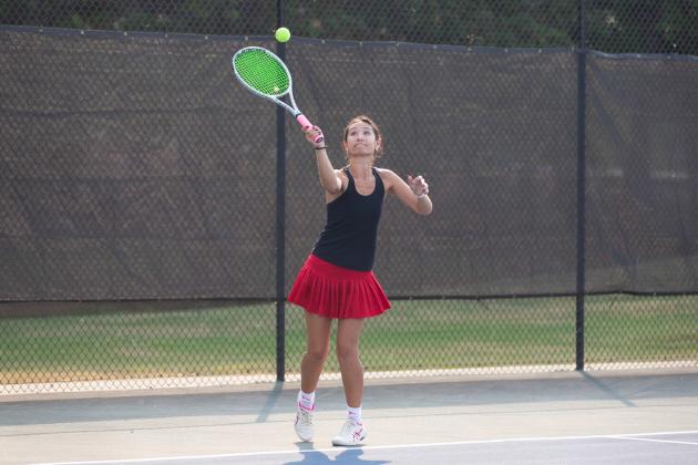 As part of the No. 1 doubles team, Lindsey Young lines up a serve. SKYLA MORRIS/Staff