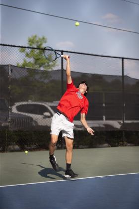 As part of the No. 1 doubles team, Lindsey Young lines up a serve. SKYLA MORRIS/Staff