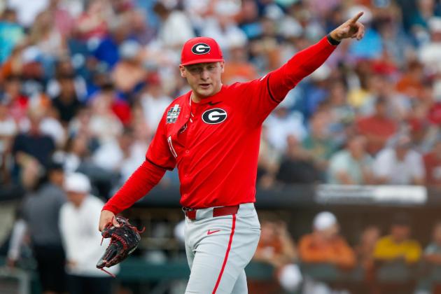 Georgia pitcher Dylan Vigue points to a teammate after a defensive play ends the inning against Texas on Tuesday night. LANCE McCURLEY/Staff
