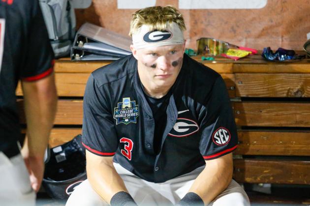 Georgia catcher Daniel Jackson sits in the dugout contemplating what might have been after the Bulldogs’ 11-4 loss to Oklahoma on June 17. LANCE McCURLEY/Staff