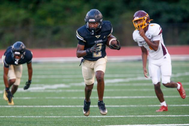 Greene County defensive back QJ Robbins returns an interception during last week’s scrimmage. LANCE McCURLEY/Staff