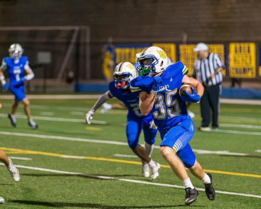 Titans senior running back Griffin Stanford runs on a kick return against the War Eagles. SKYLA MORRIS/Staff