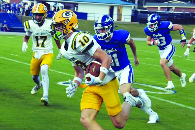 Gatewood quarterback Blake Brannen (10) rushes past Brentwood defenders in last Friday night's loss to the War Eagles. IAN TOCHER/Staff