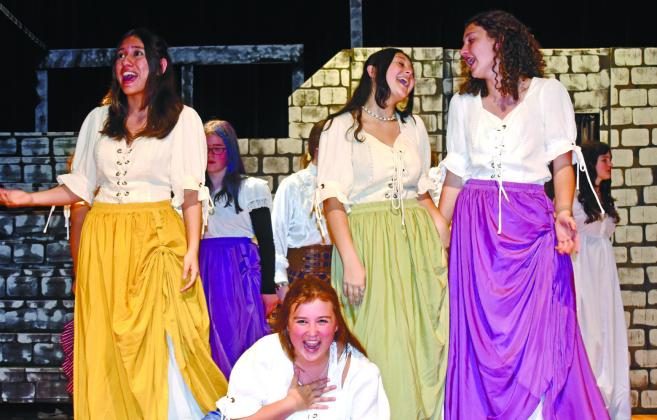 L to R: Daniela Carrasco-Portillo, Addison Hutsell, Gabriella Rhyne, and Joelyn Madden, play villagers fawning over Gaston.