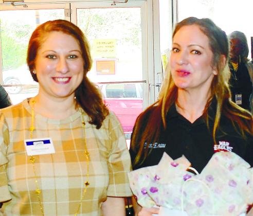 GWM Executive Director Melissa Swindell (left) presented a gift bag to PCHS teacher Rebekah Esau in appreciation of her work for the Live and Drive Book Fair.