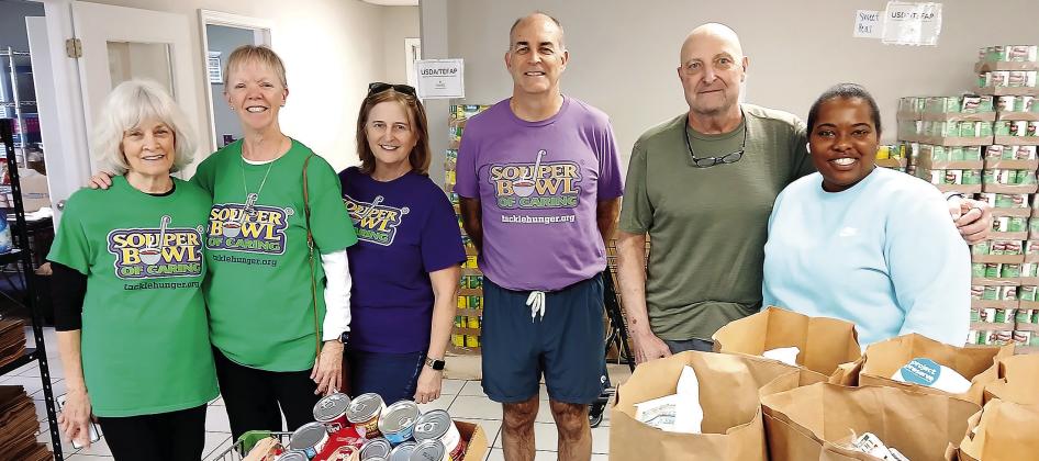 The group unloading food at the new Greene County Food Pantry building. CONTRIBUTED