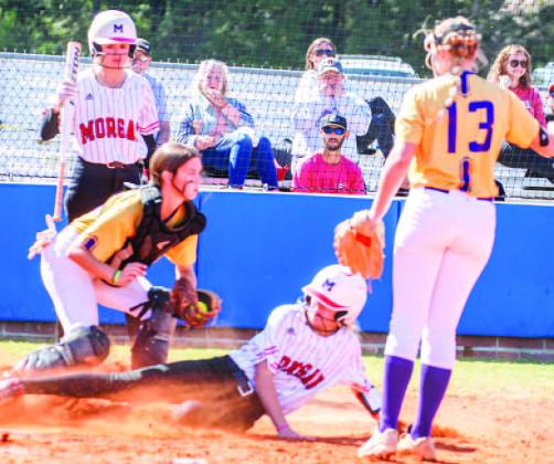 Tallie Ray slides into home safely against Calvary Day. LANCE MCCURLEY/Staff