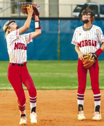 Emmy Moss (left) catches a routine pop-up in the seventh inning versus Oconee County. LANCE McCURLEY/Staff