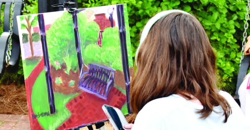 An artist works on a painting as part of MAGallery’s Plein Air Paint Out. (T. MICHAEL STONE/Staff)