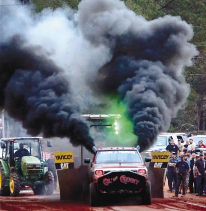 “Thank a Trucker” comes down the track billowing black smoke from both sides.”