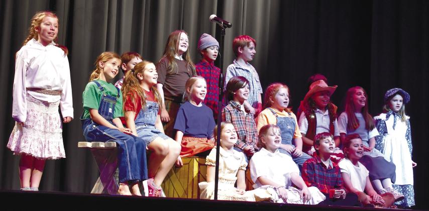 A group of young actors sing a song about Davy Crockett. LENA HENSLEY/Staff