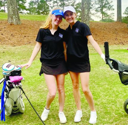 Freshmen duo Kensley Windham (left) and Kallyn Black (right) scored third out of 30 pairings in the Lady Titans first event of the year. CONTRIBUTED