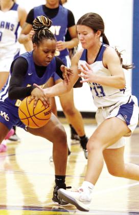 Mary Claire McCommons (13) tries to steal the ball away from a Warren County guard. LANCE McCURLEY/Staff