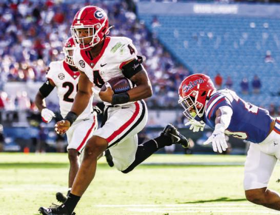 Linebacker Nolan Smith (4) records one of two interceptions for the Bulldogs, leading to an eventual touchdown in 2021. MACKENZIE MILES/UGA Athletics