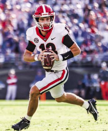 Quarterback Stetson Bennett rolls out of the pocket during the 2021 matchup with the Gators. Bennett went 10-for-19 for 161 yards. MACKENZIE MILES/UGA Athletics